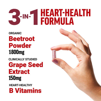 Hand holding a supplement capsule with heart-health formula details.
